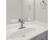 This bathroom features a single sink with bright white cabinets and bright white walls at 1201 Teakwood Ct, Sanford, NC 27330