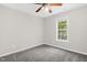 Cozy bedroom with neutral carpet, ceiling fan, and window at 1201 Teakwood Ct, Sanford, NC 27330