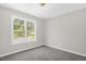 Comfortable bedroom with neutral carpet, window, and neutral walls at 1201 Teakwood Ct, Sanford, NC 27330