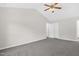 Spacious bedroom with neutral carpet, ceiling fan, and easy access to the ensuite bathroom at 1201 Teakwood Ct, Sanford, NC 27330