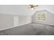 Neutral bedroom has a window for natural light and a ceiling fan for comfort at 1201 Teakwood Ct, Sanford, NC 27330