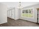 Bright dining room with hardwood floors and a large window providing natural light at 1201 Teakwood Ct, Sanford, NC 27330