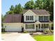 Charming two-story home with a two-car garage, well-maintained lawn, and mature trees at 1201 Teakwood Ct, Sanford, NC 27330