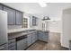 Kitchen with stainless steel appliances, ample counter space, and adjacent living area at 1201 Teakwood Ct, Sanford, NC 27330