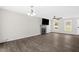 Open living room featuring wood floors, a fireplace, neutral walls, and recessed lighting at 1201 Teakwood Ct, Sanford, NC 27330