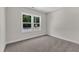 An empty bedroom with a window at 125 Davis St, Louisburg, NC 27549