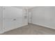 Cozy bedroom featuring a carpeted floor, closet, and neutral paint at 125 Davis St, Louisburg, NC 27549
