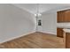 Bright dining area featuring wood floors, modern lighting and a view to the backyard at 125 Davis St, Louisburg, NC 27549