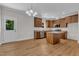 Well-lit kitchen offers a view to the backyard and boasts generous cabinet space and modern appliances at 125 Davis St, Louisburg, NC 27549