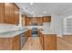 Spacious kitchen showcasing granite countertops and stainless steel appliances and lots of cabinet space at 125 Davis St, Louisburg, NC 27549