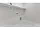 Functional laundry room with shelf, offering convenience and storage for laundry needs at 125 Davis St, Louisburg, NC 27549