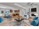 Open-concept living space showcases the seamless flow between living room, kitchen, and dining, perfect for modern living at 125 Davis St, Louisburg, NC 27549