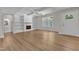 Bright, open living room offers a fireplace, built-in shelving and a view to the outside at 125 Davis St, Louisburg, NC 27549