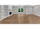 Bright living room with fireplace, built-ins, and natural light, perfect for comfortable living at 125 Davis St, Louisburg, NC 27549