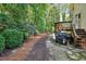 Spacious backyard with lush greenery, a well-maintained lawn, and a wooden deck at 1437 Lindenberg Sq, Wake Forest, NC 27587