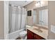 Well-lit bathroom featuring a shower-tub combo and a single sink vanity with ample counter space at 1437 Lindenberg Sq, Wake Forest, NC 27587