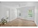 Bright bedroom with plush carpet, ceiling fan, and two large windows offering plenty of natural light at 1437 Lindenberg Sq, Wake Forest, NC 27587