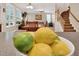 The house features an open concept living room with large windows, comfortable seating, and a view of the staircase at 1437 Lindenberg Sq, Wake Forest, NC 27587