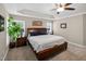 A spacious primary bedroom with a tray ceiling, neutral walls, carpet flooring, and a king-size bed at 1437 Lindenberg Sq, Wake Forest, NC 27587