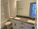 Bright bathroom with double sink vanity, white cabinets, and shower-tub combination at 1563 Wendell Valley Blvd, Wendell, NC 27591