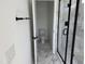 Bathroom featuring a marble-tiled floor, a black-framed shower, and a separate toilet room at 1563 Wendell Valley Blvd, Wendell, NC 27591