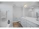 Well-lit bathroom with modern fixtures, double vanity, and glass-enclosed shower at 174 Arrow Ln, Middlesex, NC 27557