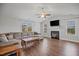 Bright living room with vaulted ceilings, fireplace, and hardwood floors at 174 Arrow Ln, Middlesex, NC 27557