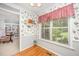 Cozy breakfast nook featuring hardwood floors and a large window, perfect for morning meals and relaxation at 1822 Atterbury Ln, Durham, NC 27712