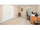 Home office with a chair, desk, and window with blinds, offering a functional workspace at 1822 Atterbury Ln, Durham, NC 27712