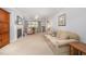 Spacious living room with neutral walls, fireplace, ceiling fan, and ample natural light from large windows at 1822 Atterbury Ln, Durham, NC 27712