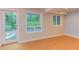 Bright basement with large windows and a door leading to the outdoor area, providing ample light at 1908 S Lakeshore Dr, Chapel Hill, NC 27514