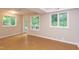 Spacious basement area with natural light, multiple windows, and neutral color scheme at 1908 S Lakeshore Dr, Chapel Hill, NC 27514