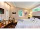 Bright bedroom with hardwood floors, comfortable furniture, and decor at 1908 S Lakeshore Dr, Chapel Hill, NC 27514