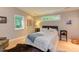 Bright bedroom with hardwood floors, comfortable furniture, and decor at 1908 S Lakeshore Dr, Chapel Hill, NC 27514