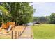 Community park featuring playground and access to lake at 1908 S Lakeshore Dr, Chapel Hill, NC 27514