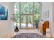 Bright foyer with full front windows providing beautiful natural light and views of the landscaped yard at 1908 S Lakeshore Dr, Chapel Hill, NC 27514