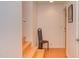 Hallway featuring light hardwood stairs and flooring plus a modern chair at 1908 S Lakeshore Dr, Chapel Hill, NC 27514