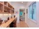 Hallway to a bright bedroom featuring a wood desk and ample storage and views at 1908 S Lakeshore Dr, Chapel Hill, NC 27514