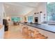 Open-concept kitchen with large island, stainless steel appliances, and bar stool seating at 1908 S Lakeshore Dr, Chapel Hill, NC 27514