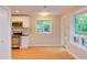 Kitchen with stainless steel appliances, white cabinets, and natural lighting at 1908 S Lakeshore Dr, Chapel Hill, NC 27514