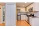 Well-lit kitchen featuring modern appliances, white cabinetry, and a stainless steel microwave at 1908 S Lakeshore Dr, Chapel Hill, NC 27514