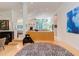 Open-concept living space featuring unique decor, zebra rug, and views to the yard at 1908 S Lakeshore Dr, Chapel Hill, NC 27514