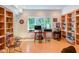 Well-lit office featuring custom built-in bookshelves and large window at 1908 S Lakeshore Dr, Chapel Hill, NC 27514