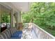 Outdoor patio with comfortable seating area and views of the lush, green surroundings at 1908 S Lakeshore Dr, Chapel Hill, NC 27514