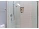 Modern shower featuring tiled walls, a glass door, and sleek fixtures at 1908 S Lakeshore Dr, Chapel Hill, NC 27514