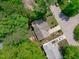 Bird's eye view of house with a backyard deck nestled amongst lush trees at 208 Silk Hope Dr, Cary, NC 27519