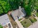 Overhead image of a two-story home, with a symmetrical front facade and manicured lawn at 208 Silk Hope Dr, Cary, NC 27519