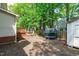 Large backyard featuring a wood deck, ample greenspace, and a trampoline for outdoor activities at 208 Silk Hope Dr, Cary, NC 27519