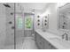 Spa-like bathroom featuring a frameless glass shower, dual sink vanity, and sleek finishes at 208 Silk Hope Dr, Cary, NC 27519