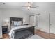 Bright bedroom with a vaulted ceiling, board and batten, and ensuite bathroom at 208 Silk Hope Dr, Cary, NC 27519